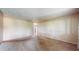 Bright, airy living room with neutral walls and carpeting, offering a versatile space at 8630 E Mcgregor Rd, Indianapolis, IN 46259