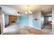 Comfortable living room with a brick fireplace, ceiling fan, and neutral carpeting at 8630 E Mcgregor Rd, Indianapolis, IN 46259