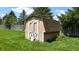 Close up of backyard shed with double doors on a well-manicured lawn at 8630 E Mcgregor Rd, Indianapolis, IN 46259