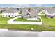 Aerial view of the house with a fenced backyard, a patio with gazebo, and a scenic pond nearby at 89 Kinnick Dr, Greenwood, IN 46143