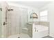 Bathroom featuring a separate shower with glass door and soaking tub, offering a spa-like experience at 89 Kinnick Dr, Greenwood, IN 46143