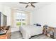 Comfortable bedroom with ceiling fan, and dresser, offering a serene space for rest and relaxation at 89 Kinnick Dr, Greenwood, IN 46143