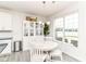 Cozy dining area features natural light and seamless access to the kitchen and outdoor spaces at 89 Kinnick Dr, Greenwood, IN 46143
