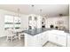 Well-designed kitchen adjacent to a dining area and living space with abundant natural light at 89 Kinnick Dr, Greenwood, IN 46143