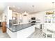 Bright, eat-in kitchen features a large island, stainless steel appliances, and stylish white cabinetry at 89 Kinnick Dr, Greenwood, IN 46143