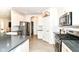 Bright kitchen features stainless steel appliances, white cabinets, and modern finishes at 89 Kinnick Dr, Greenwood, IN 46143