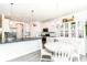 Open-concept kitchen features stainless steel appliances, an island, and an adjacent dining area at 89 Kinnick Dr, Greenwood, IN 46143