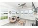 Bright living room boasts large windows, comfortable seating, and modern flooring for relaxation at 89 Kinnick Dr, Greenwood, IN 46143