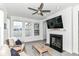 Comfortable living room features a fireplace, large windows, and an open layout for entertaining at 89 Kinnick Dr, Greenwood, IN 46143
