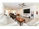 Expansive living room with hardwood floors and fireplace, perfect for entertaining or relaxing at 89 Kinnick Dr, Greenwood, IN 46143