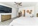 Spacious main bedroom offers a ceiling fan, gray plank floors, and neutral paint, creating a comfortable retreat at 89 Kinnick Dr, Greenwood, IN 46143
