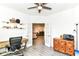 Open-concept office featuring French doors leading to an adjacent living room at 89 Kinnick Dr, Greenwood, IN 46143