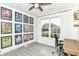 Well-lit office featuring wood-look floors, modern ceiling fan, and a large window at 89 Kinnick Dr, Greenwood, IN 46143