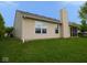 Exterior shot featuring vinyl siding, a chimney, and a well-maintained backyard with an enclosed porch at 9125 Bagley Way, Indianapolis, IN 46231