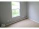 Bedroom features neutral carpet and a window view of the property at 9125 Bagley Way, Indianapolis, IN 46231