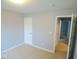 This bedroom is spacious, featuring neutral carpet, fresh paint and access to the hallway at 9125 Bagley Way, Indianapolis, IN 46231