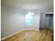 Well-lit dining area with hardwood floors, a modern light fixture and neutral paint scheme at 9125 Bagley Way, Indianapolis, IN 46231