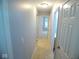 Hallway features neutral carpet, fresh paint and access to the rooms at 9125 Bagley Way, Indianapolis, IN 46231