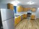 Modern kitchen featuring stainless steel appliances, updated countertops, and wood cabinetry at 9125 Bagley Way, Indianapolis, IN 46231