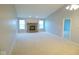 Large living room features a brick fireplace and dual windows for lots of natural light at 9125 Bagley Way, Indianapolis, IN 46231