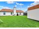Spacious back yard featuring a lush green lawn, storage shed, and ample room for outdoor activities at 917 Congressional Way, Shelbyville, IN 46176