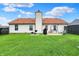 Large back yard features well-maintained lawn, patio, barbecue area, and convenient shed at 917 Congressional Way, Shelbyville, IN 46176
