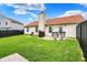 Spacious backyard featuring a well-maintained lawn, patio, grilling area, and comfortable seating at 917 Congressional Way, Shelbyville, IN 46176