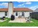Cozy backyard patio with a grill, seating, and a well-maintained lawn at 917 Congressional Way, Shelbyville, IN 46176