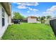 Large backyard featuring a shed, grilling area, and a pond with fountain at 917 Congressional Way, Shelbyville, IN 46176