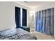 Bedroom featuring modern amenities and a window with dark curtains for privacy at 917 Congressional Way, Shelbyville, IN 46176