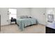 Well-lit bedroom with light carpet and a window view that provide great natural light at 917 Congressional Way, Shelbyville, IN 46176