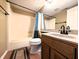 Bright bathroom featuring a shower over tub with a toilet and vanity at 93 Lookout Ridge Dr # 24U, Columbus, IN 47201