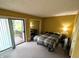 Bedroom featuring carpet, access to a balcony, and natural light at 93 Lookout Ridge Dr # 24U, Columbus, IN 47201