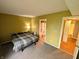 Spacious bedroom with en-suite bathroom and closet featuring neutral walls and plush carpeting at 93 Lookout Ridge Dr # 24U, Columbus, IN 47201