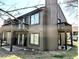 Exterior view of a two-story home featuring a walk-out basement and a private deck at 93 Lookout Ridge Dr # 24U, Columbus, IN 47201