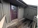 Exterior view of unit 93 featuring private balcony, siding, and an exterior light fixture at 93 Lookout Ridge Dr # 24U, Columbus, IN 47201