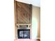 Rustic fireplace with a detailed wood surround at 93 Lookout Ridge Dr # 24U, Columbus, IN 47201