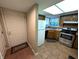 Cozy kitchen featuring stainless steel appliances, tile floors, wood cabinets and a sunny skylight at 93 Lookout Ridge Dr # 24U, Columbus, IN 47201