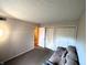 Neutral living room showcasing plush carpet and neutral wall color at 93 Lookout Ridge Dr # 24U, Columbus, IN 47201