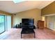 Bright living room featuring a sliding glass door to a private patio at 93 Lookout Ridge Dr # 24U, Columbus, IN 47201
