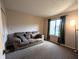 Spacious living room with large window for natural light and plush carpeting at 93 Lookout Ridge Dr # 24U, Columbus, IN 47201