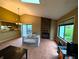 Inviting living room featuring a fireplace and seamless transition to the kitchen area at 93 Lookout Ridge Dr # 24U, Columbus, IN 47201