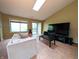 Spacious living room with tile floors and a large window offering natural light at 93 Lookout Ridge Dr # 24U, Columbus, IN 47201