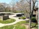 Image featuring parking under a carport with manicured landscaping at 93 Lookout Ridge Dr # 24U, Columbus, IN 47201
