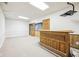 Spacious basement with tile ceiling, a bar, and neutral walls at 101 Applecross Dr, Brownsburg, IN 46112