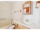 Bathroom showcasing a vanity, mirror, tub with shower, and towel rack with neutral decor at 101 Applecross Dr, Brownsburg, IN 46112