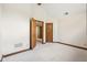 Bedroom featuring wood trim, neutral carpet and doors leading to other rooms at 101 Applecross Dr, Brownsburg, IN 46112