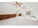 Large finished room with vaulted ceiling, skylights, carpeting, and built-in bookcases at 101 Applecross Dr, Brownsburg, IN 46112