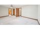 Neutral bedroom featuring plush carpeting, natural trim and doors, and a glimpse into the ensuite bathroom at 101 Applecross Dr, Brownsburg, IN 46112