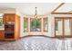 Charming breakfast nook featuring tile flooring, wood accents, and large windows with backyard views, offering a bright space at 101 Applecross Dr, Brownsburg, IN 46112